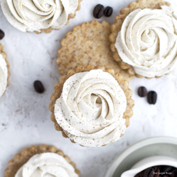 coffee sugar cookies with vanilla buttercream rosettes piped on top