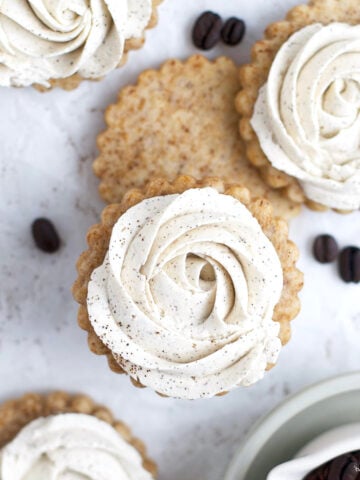 coffee sugar cookies with vanilla buttercream rosettes piped on top