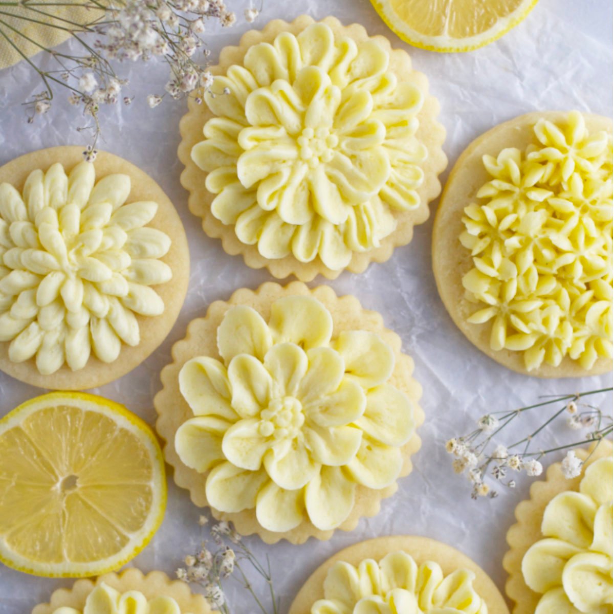 decorated lemon sugar cookies on parchment paper