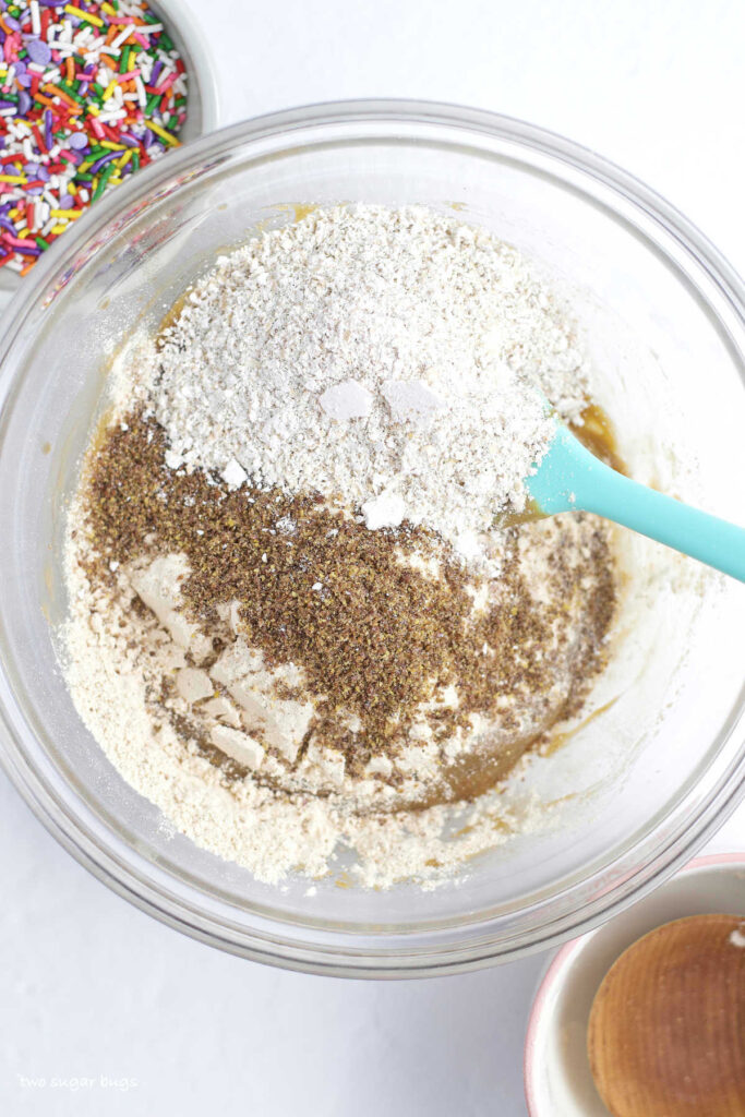 oat flour, ground flaxseed and protein powder in a bowl