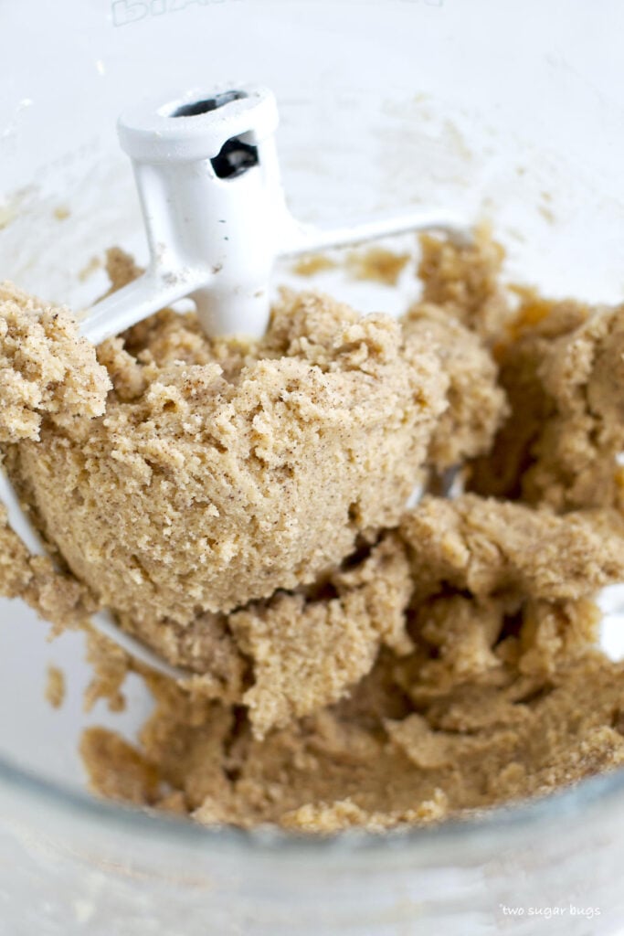 coffee sugar cookie dough balled around a mixer paddle