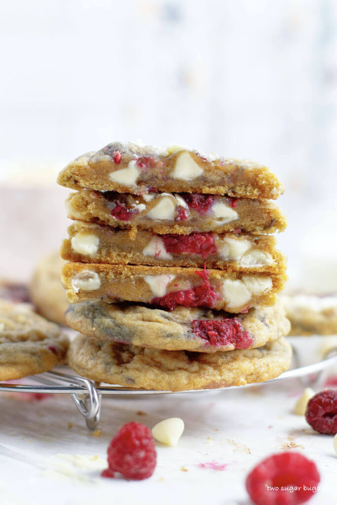 stack of white chocolate raspberry cookies with inside view