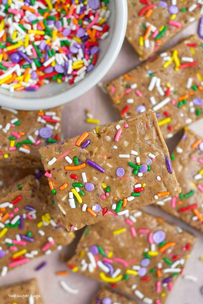 unclose look at birthday cake protein bars with a bowl of sprinkles