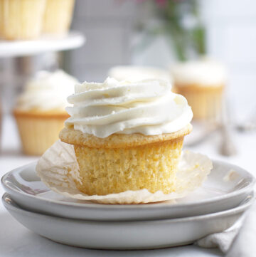 white chocolate cupcake sitting on a plate