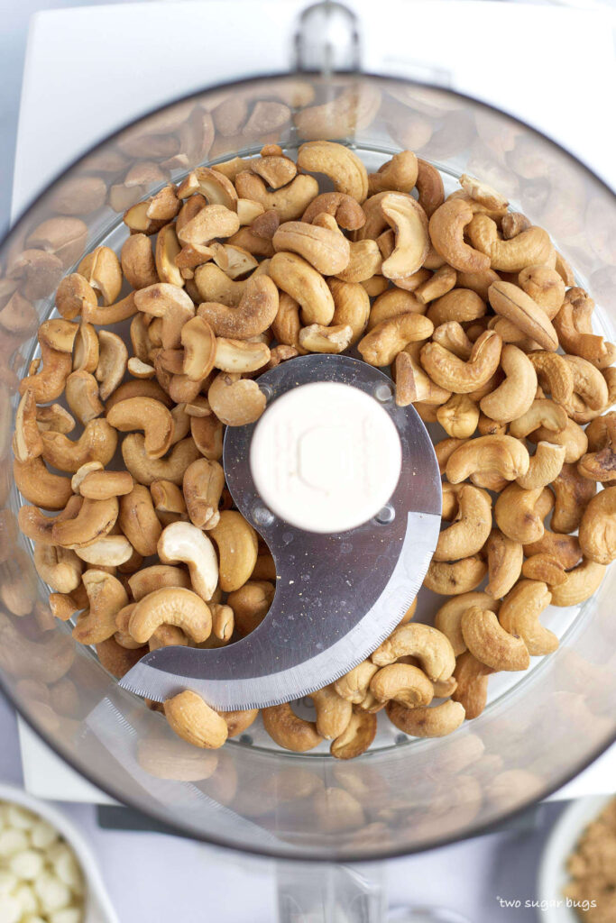 roasted cashews in a food processor bowl