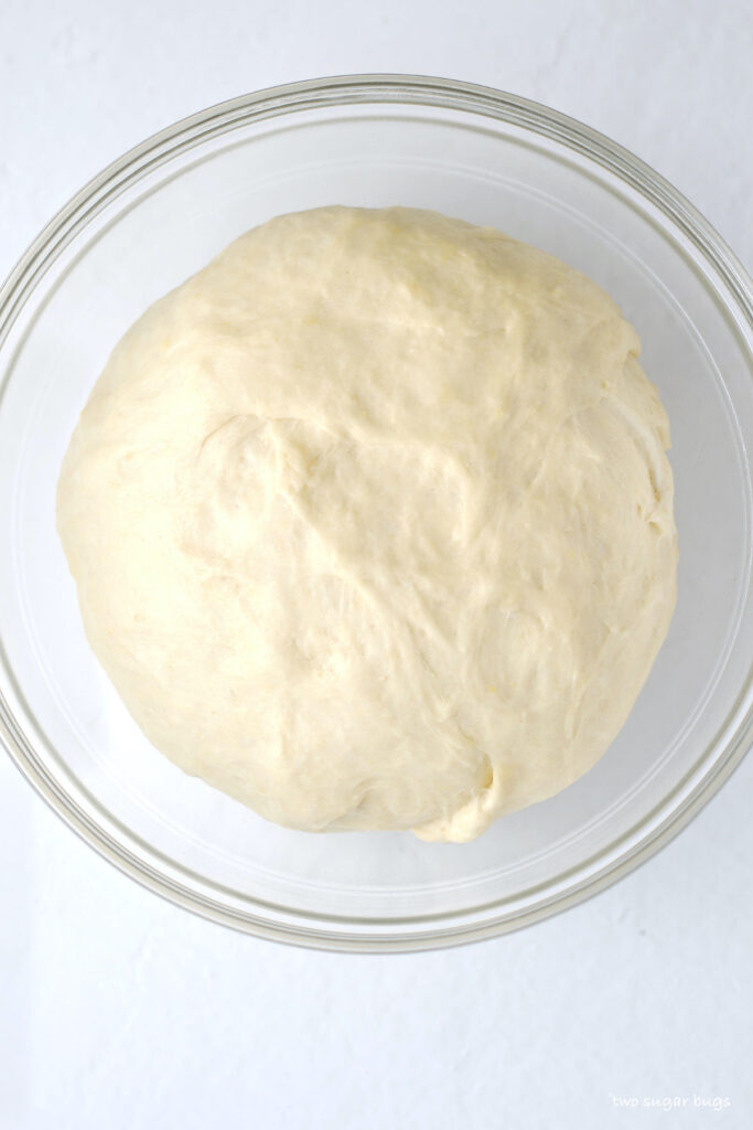 soft dough after the first rise in a bowl