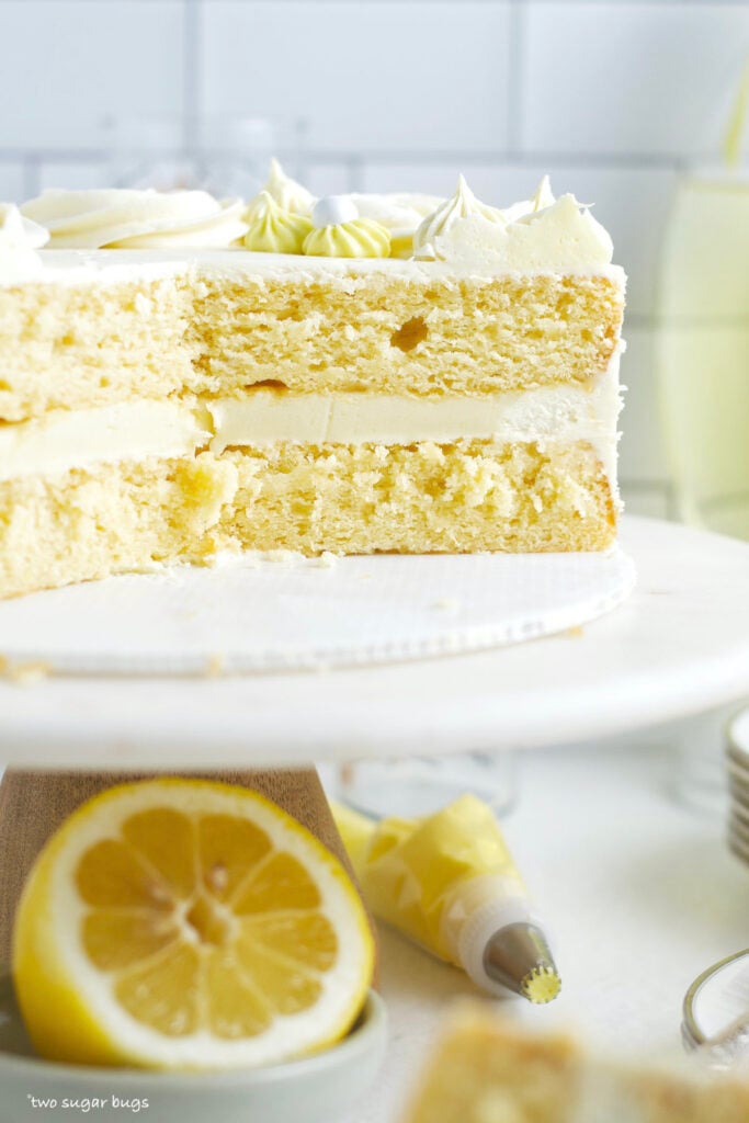 a look at the inside layers of a lemon white chocolate cake on a cake stand