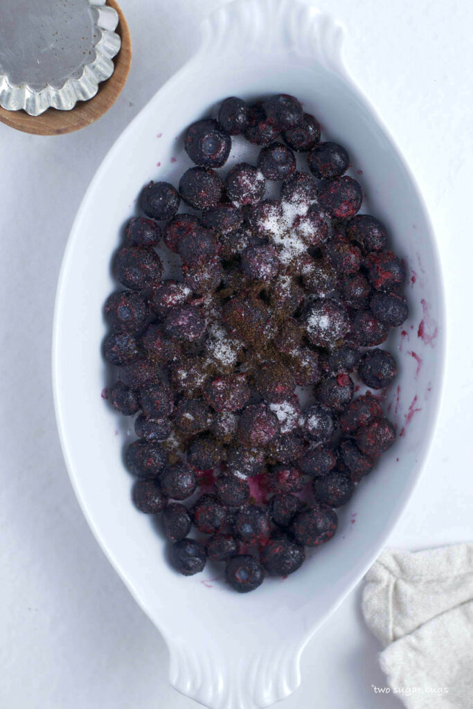 blueberries, vanilla and granulated sugar in a baking pan