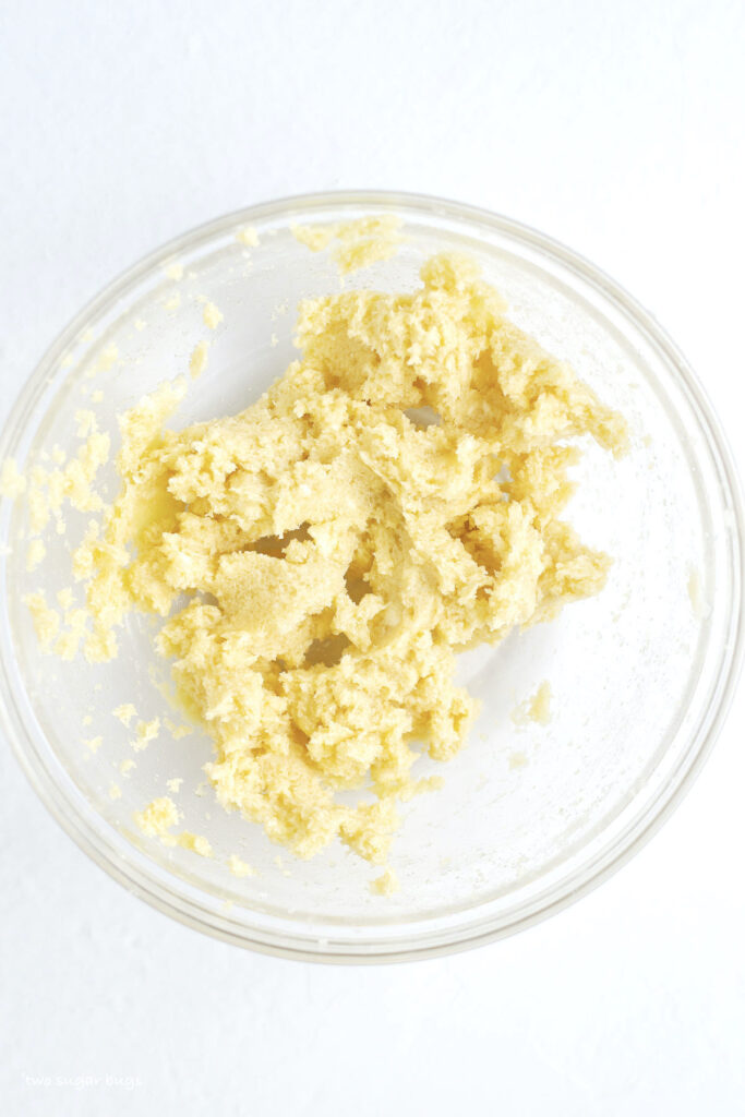 butter, sugar and egg yolk mixed in a bowl