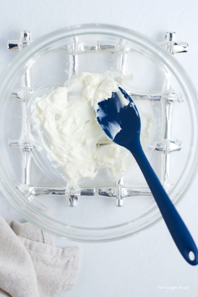 melted cream cheese in a bowl