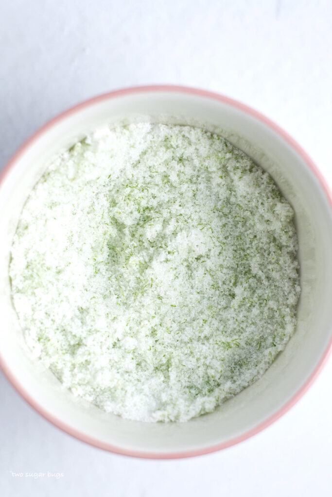 lime worked into granulated sugar in a bowl