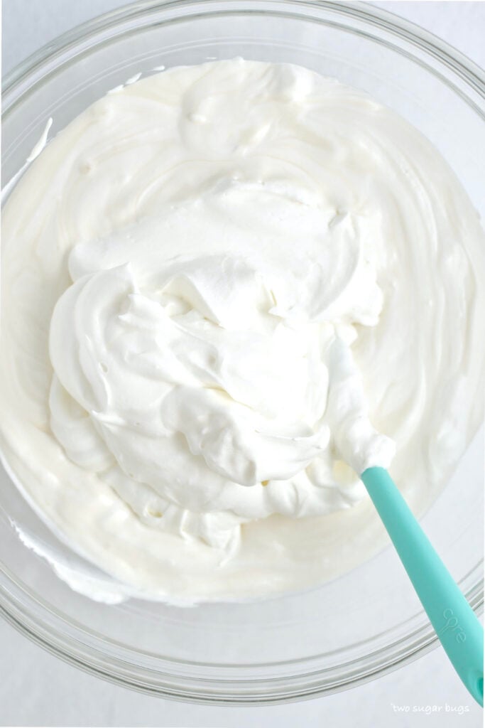 whipped cream added to sweetened condensed milk mixture