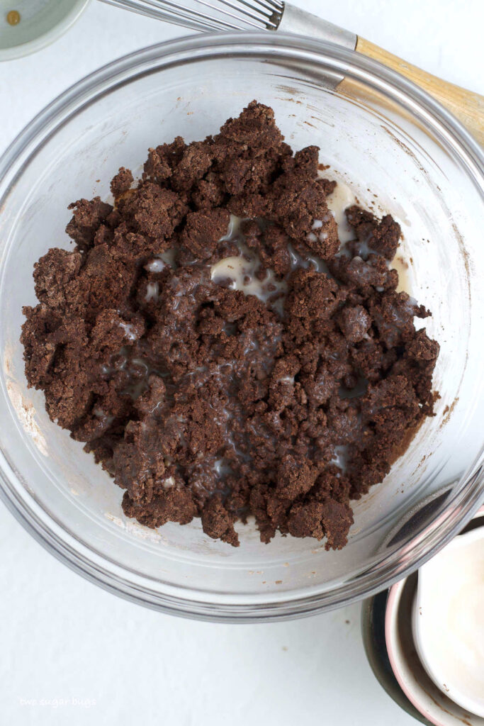 milk and edible brownie batter in a mixing bowl