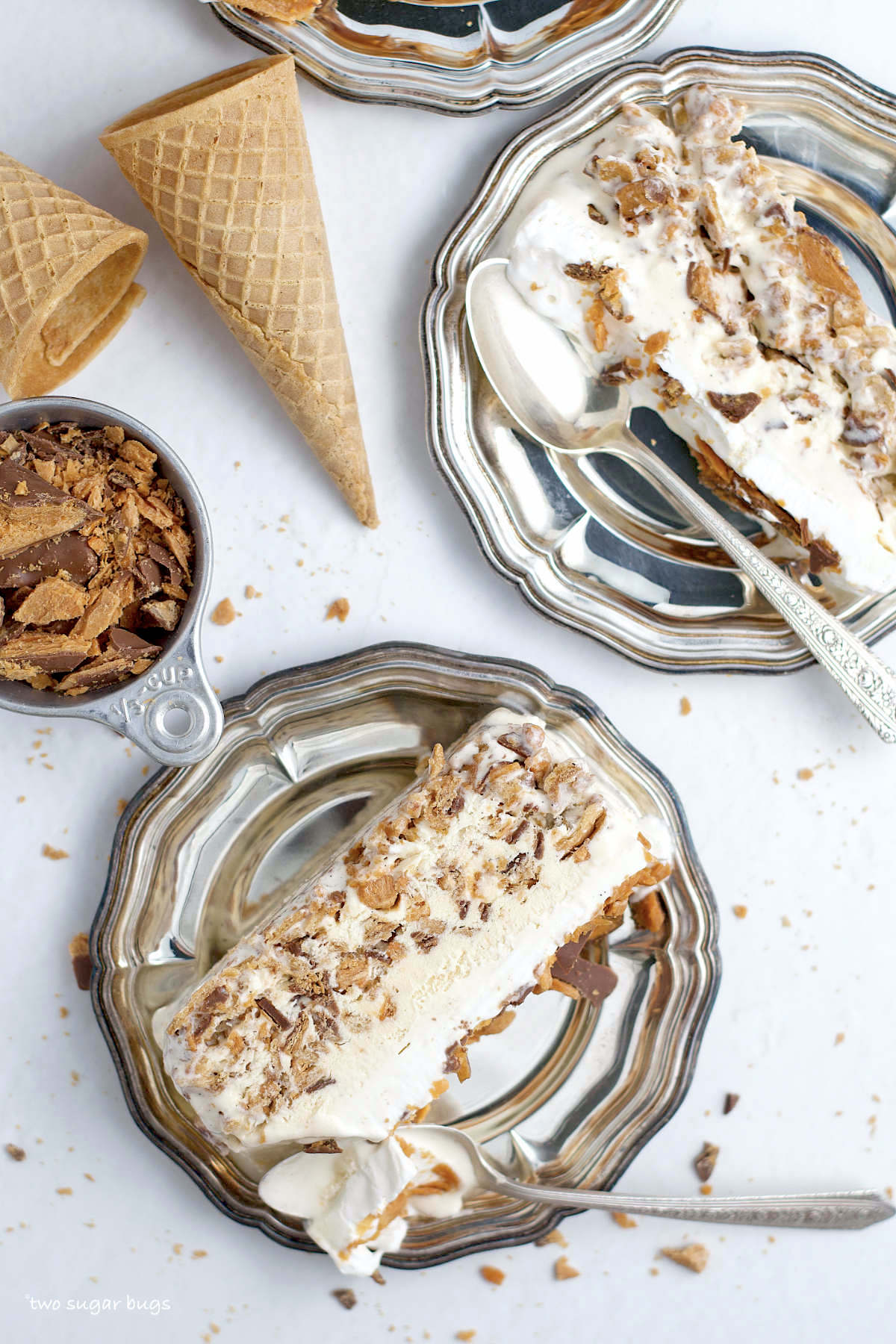 slices of butterfinger ice cream cake on plates