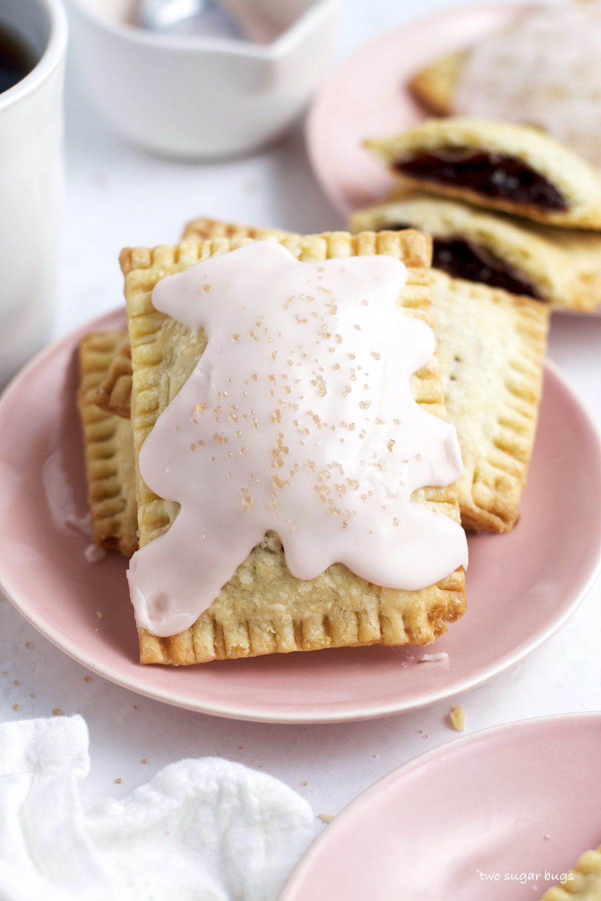 frosted cherry pop tarts on a plate