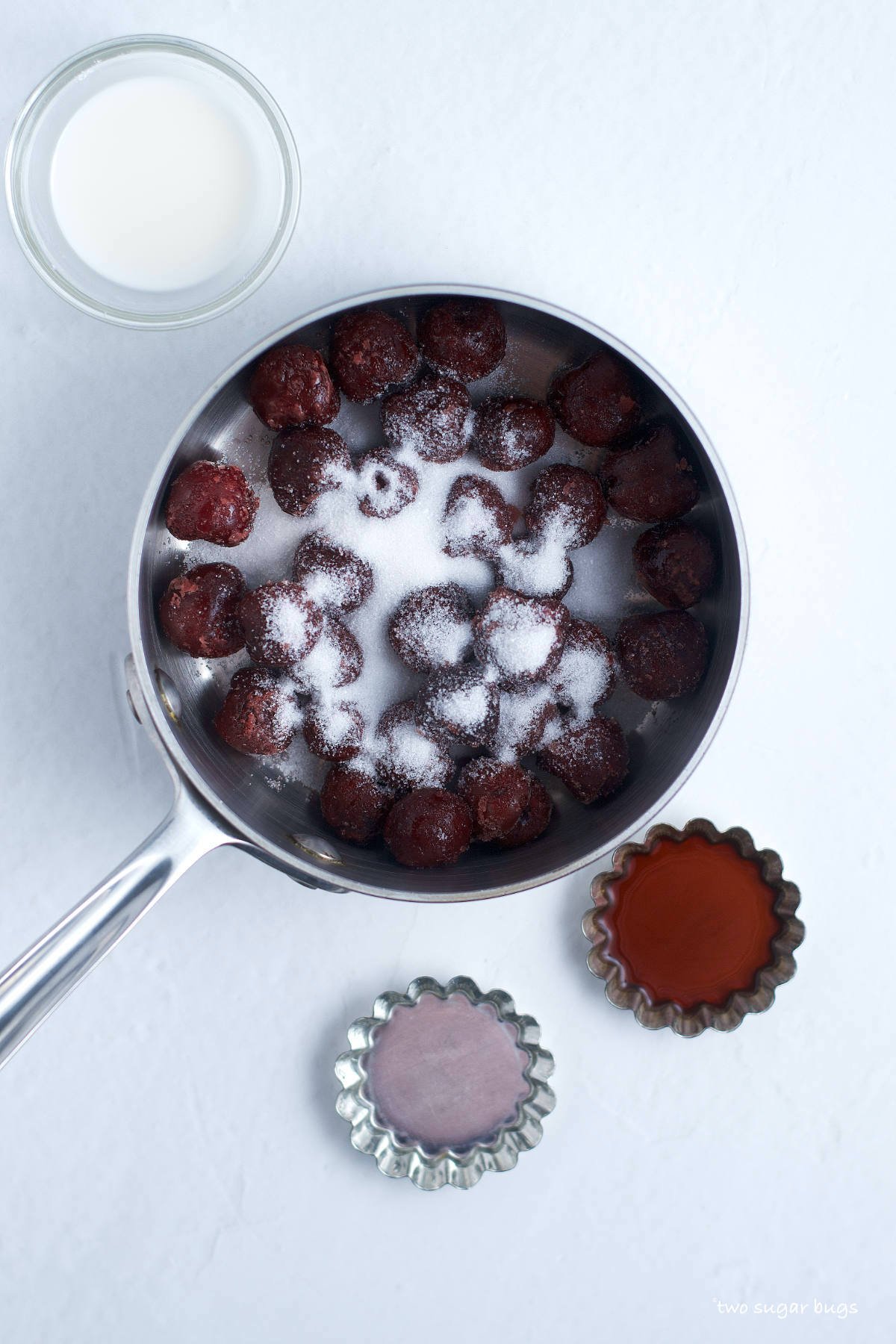 frozen cherries and sugar in a saucepan