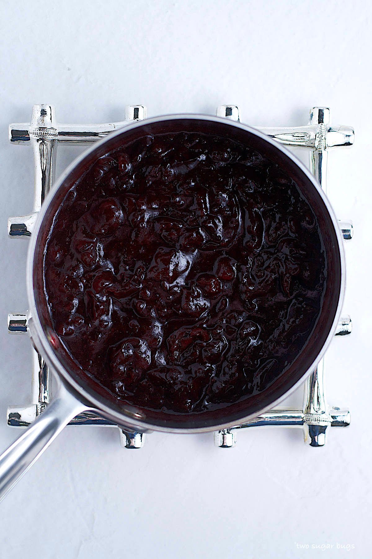 cherry jam filling in a saucepan