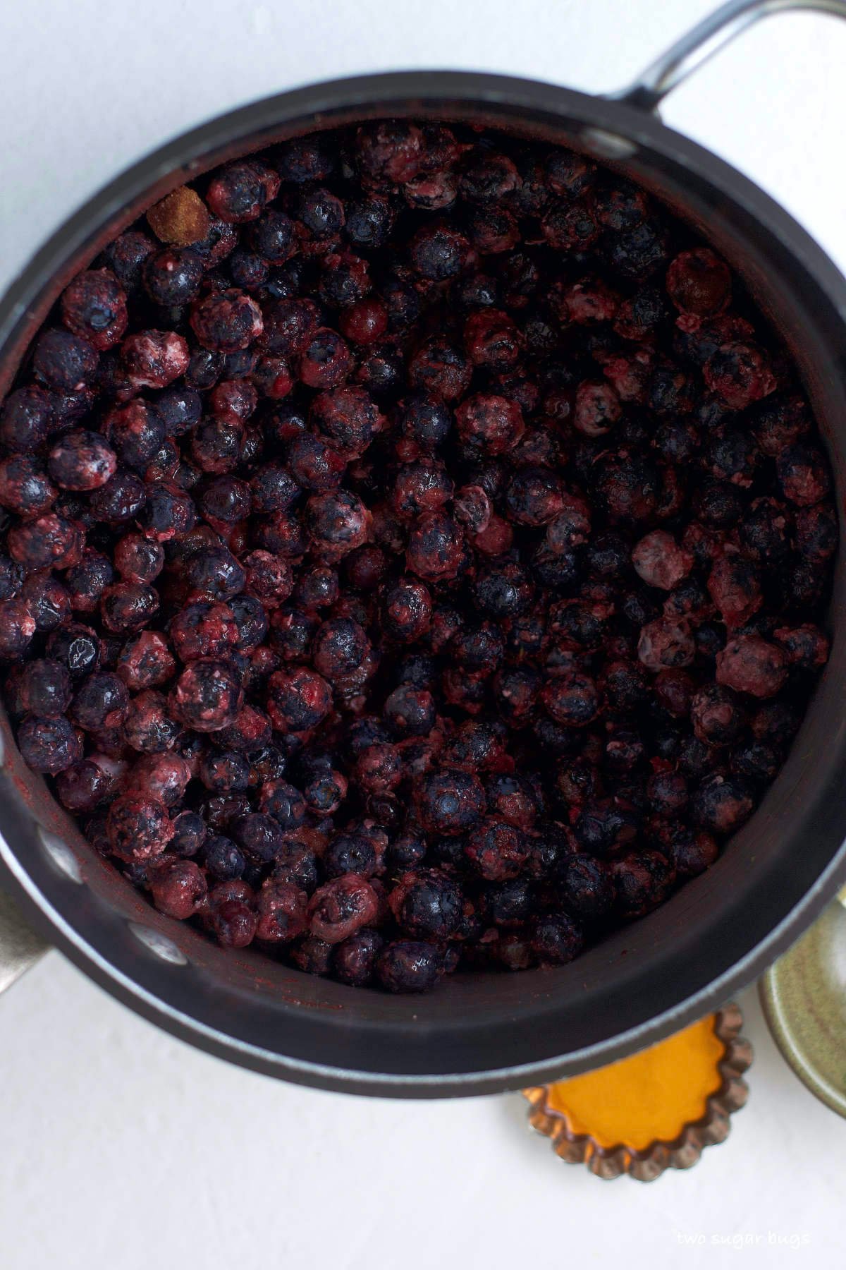 frozen blueberry filling ingredients mixed in a sauce pan