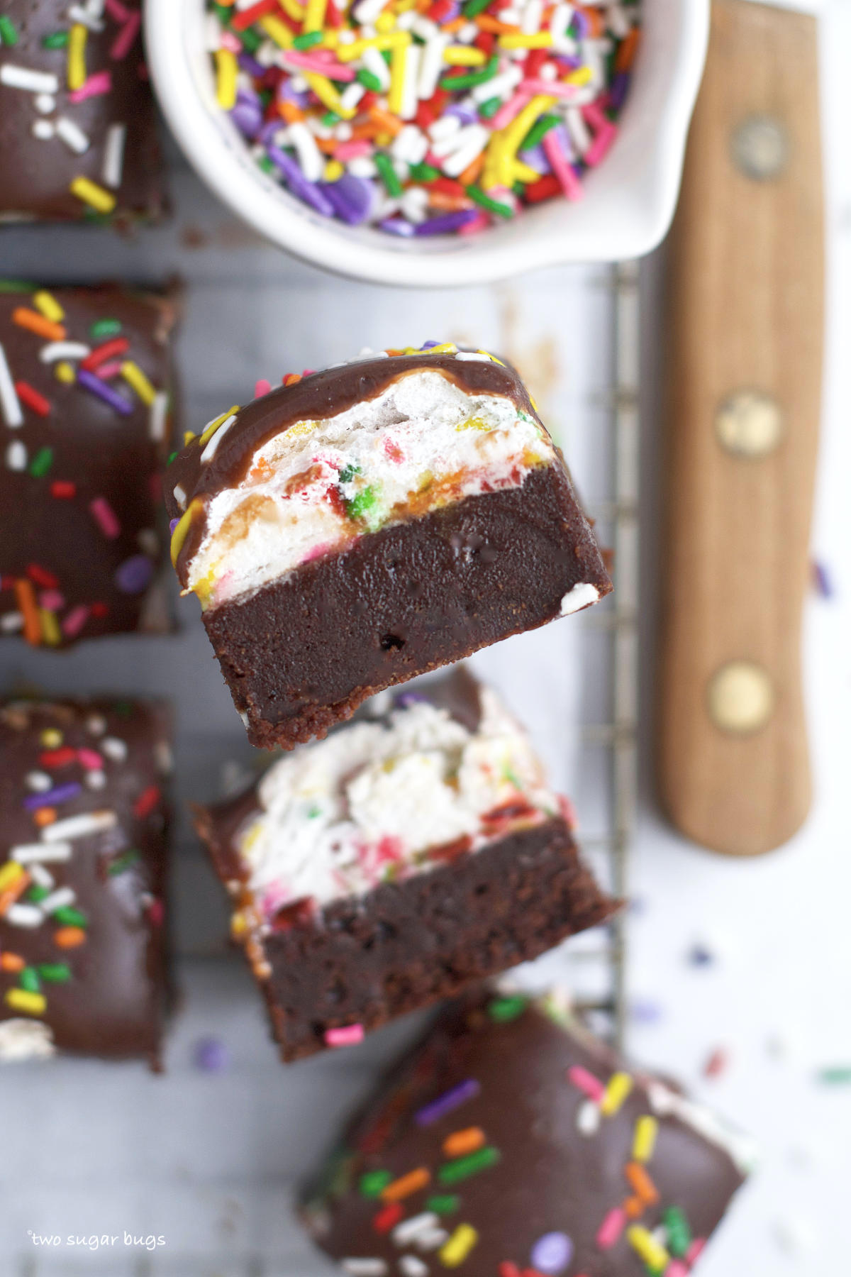 fudgy brownie layer topped with funfetti marshmallow and chocolate ganache