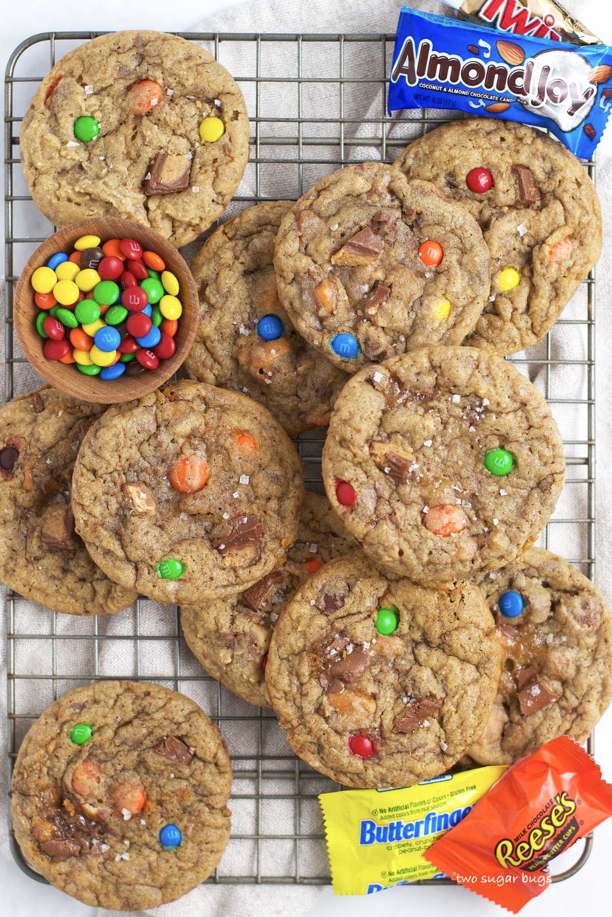 cookies with candy bars on a cooling rack