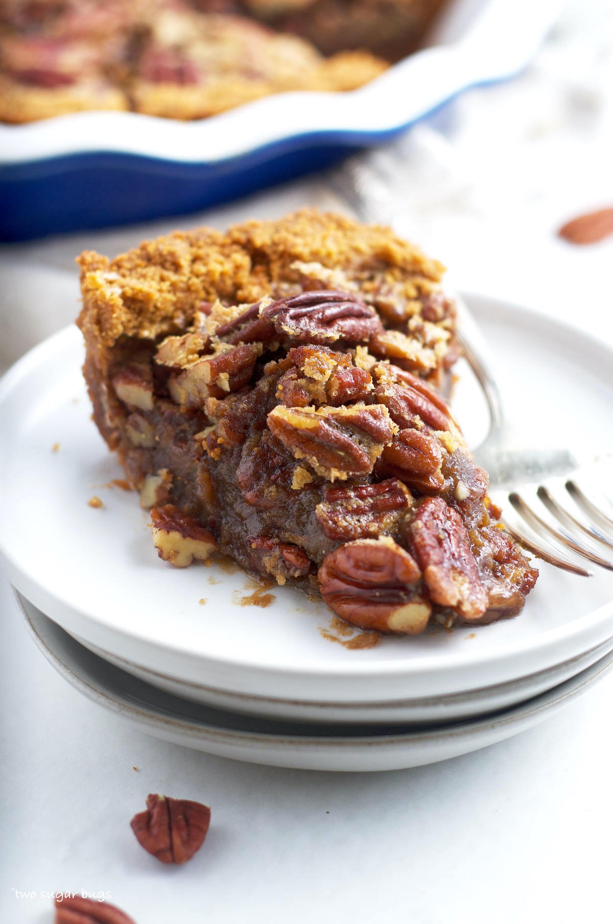slice of pecan pie without corn syrup on a plate with a fork