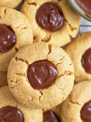 pile of peanut butter cookies with chocolate ganache
