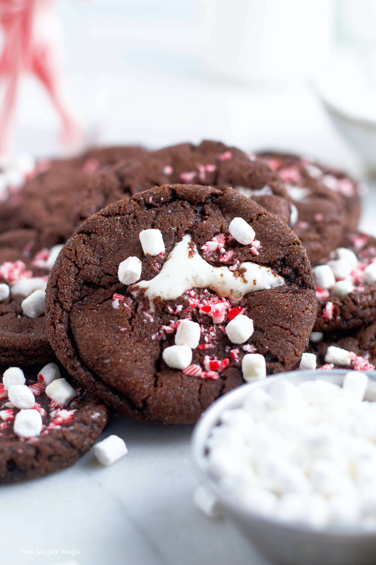 pile of cookies with a cup of mini marshmallows
