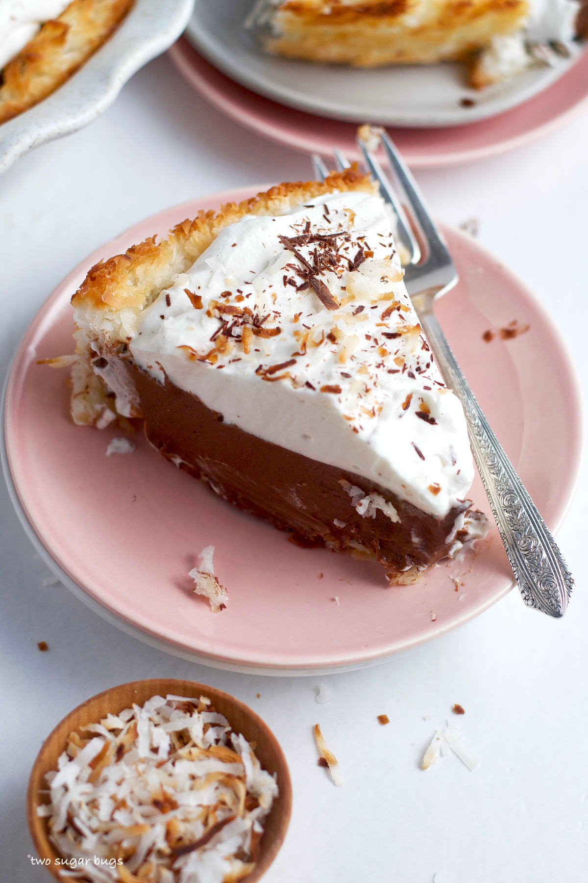 slice of chocolate coconut cream pie on a plate with a fork