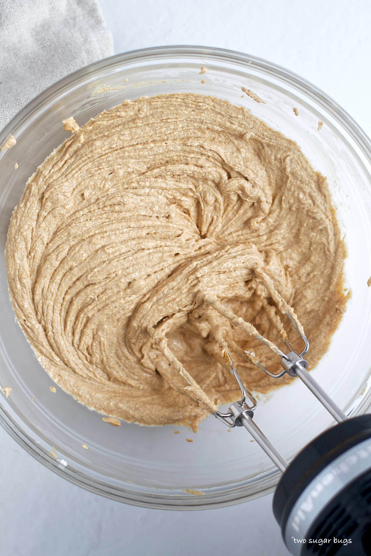 sugar, butter and peanut butter creamed in a mixing bowl