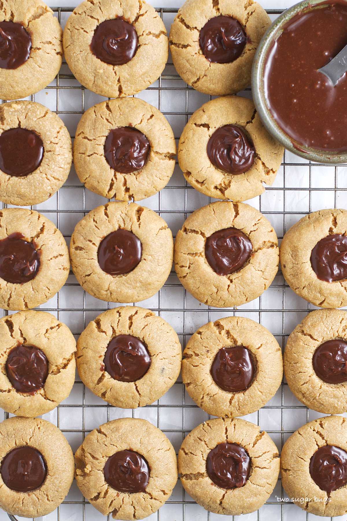peanut butter thumbprint cookies on a cooling rack