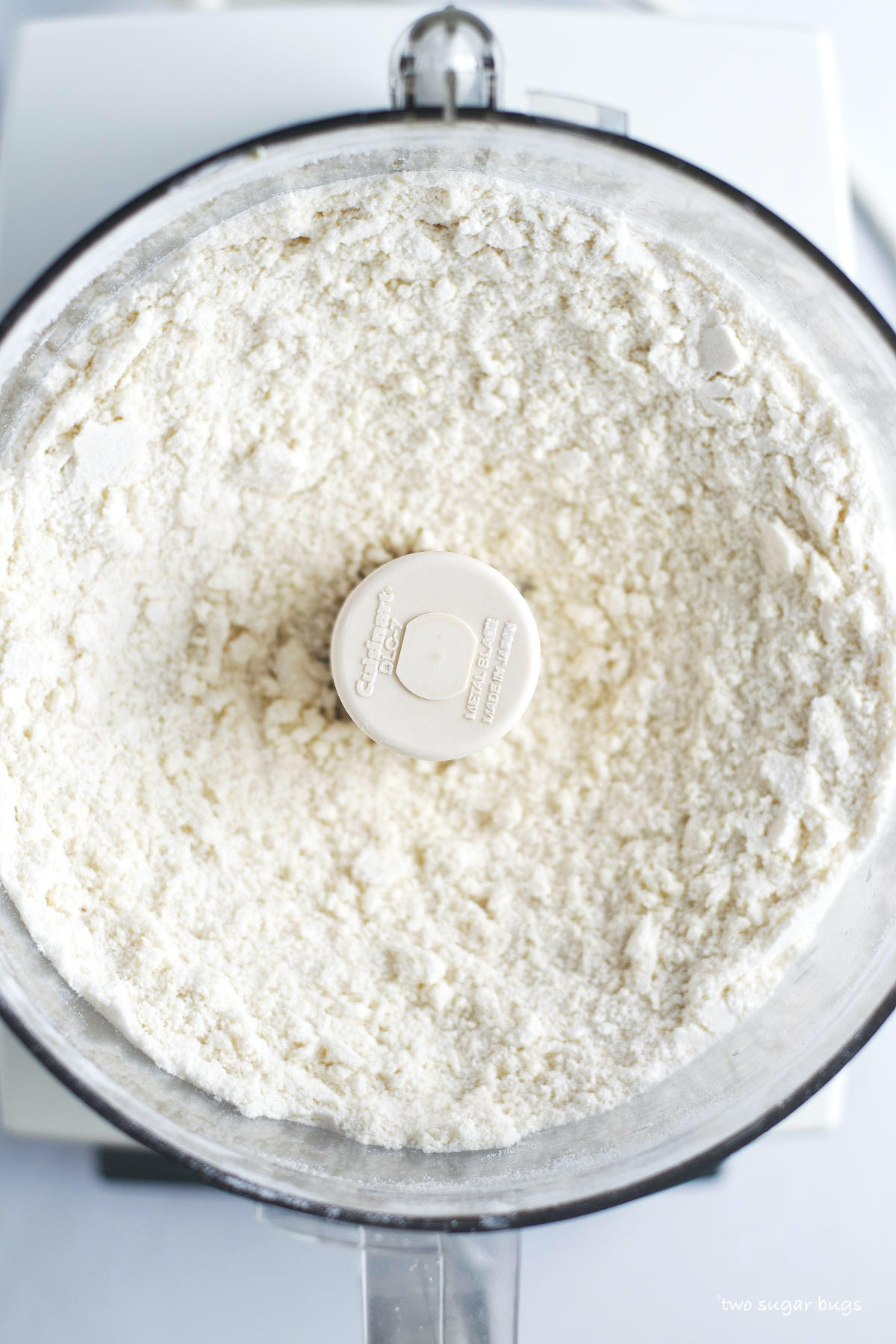 butter and dry ingredients combined in a food processor