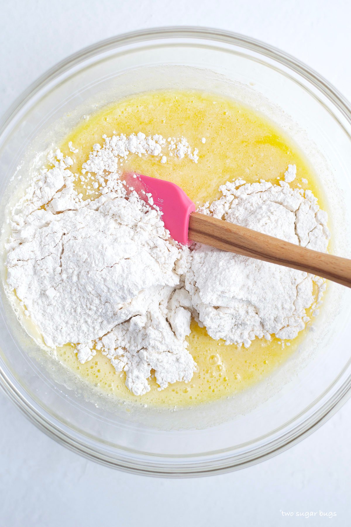 dry ingredients added to wet in a bowl