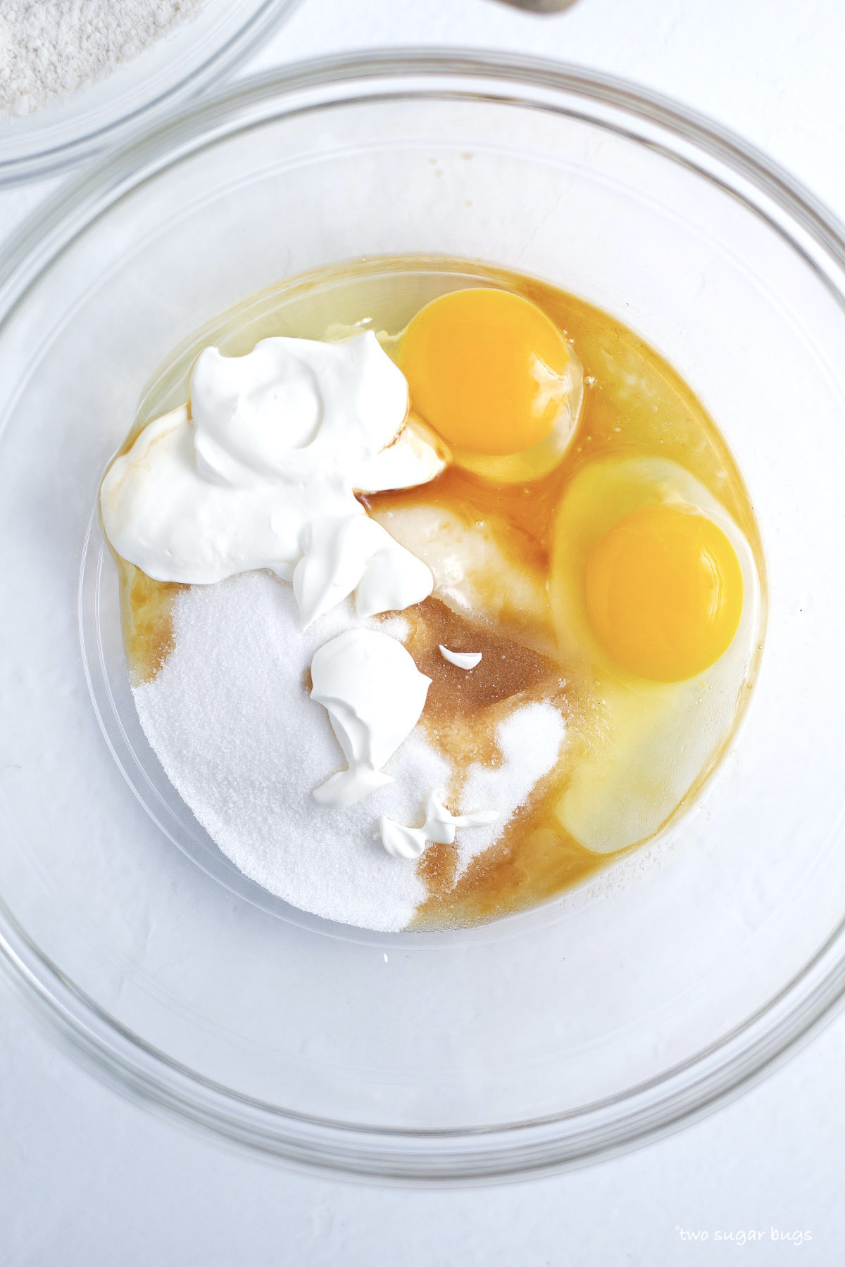 eggs, sour cream, sugar and vanilla in a bowl