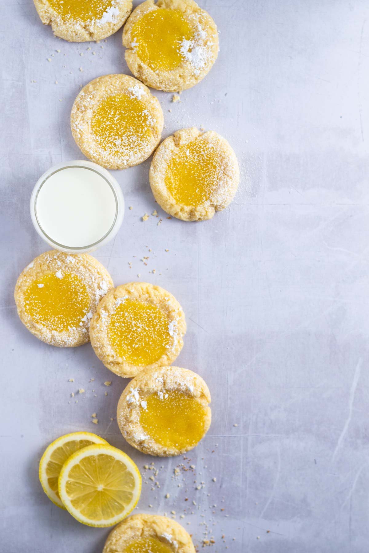 cookies with lemon slices and a glass of milk