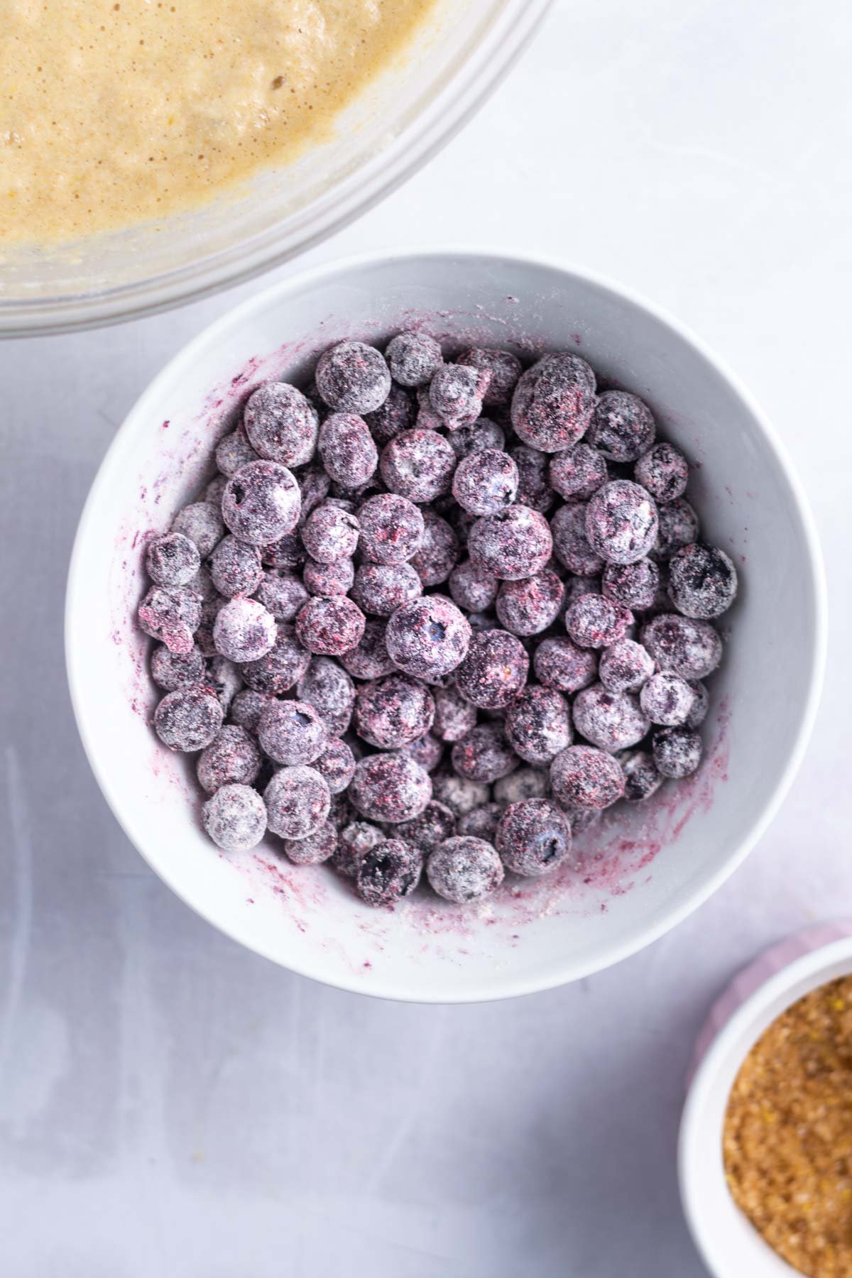blueberries tossed with flour in a bowl