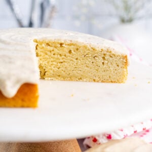 sliced cardamom cake on cake stand