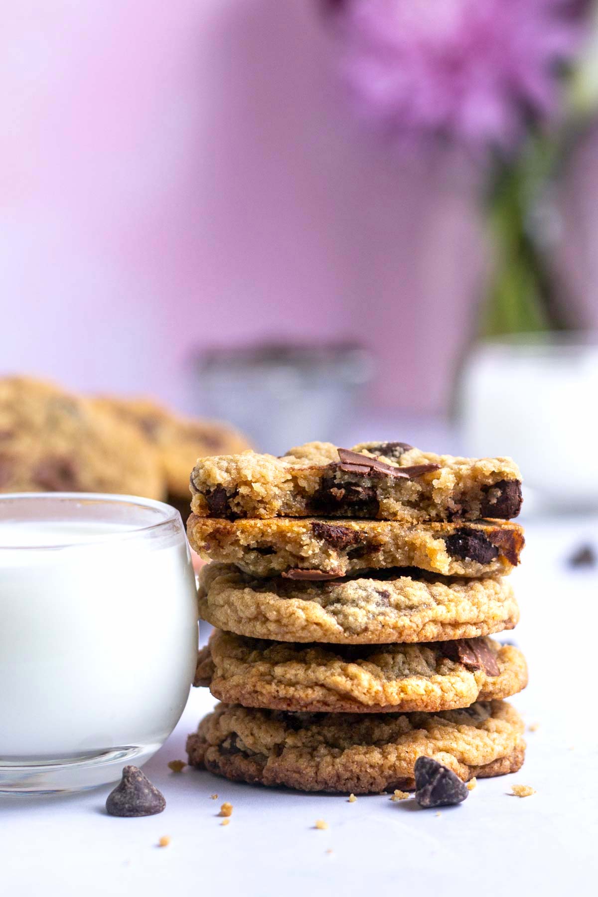 stack of egg free chocolate chip cookies with a glass of milk
