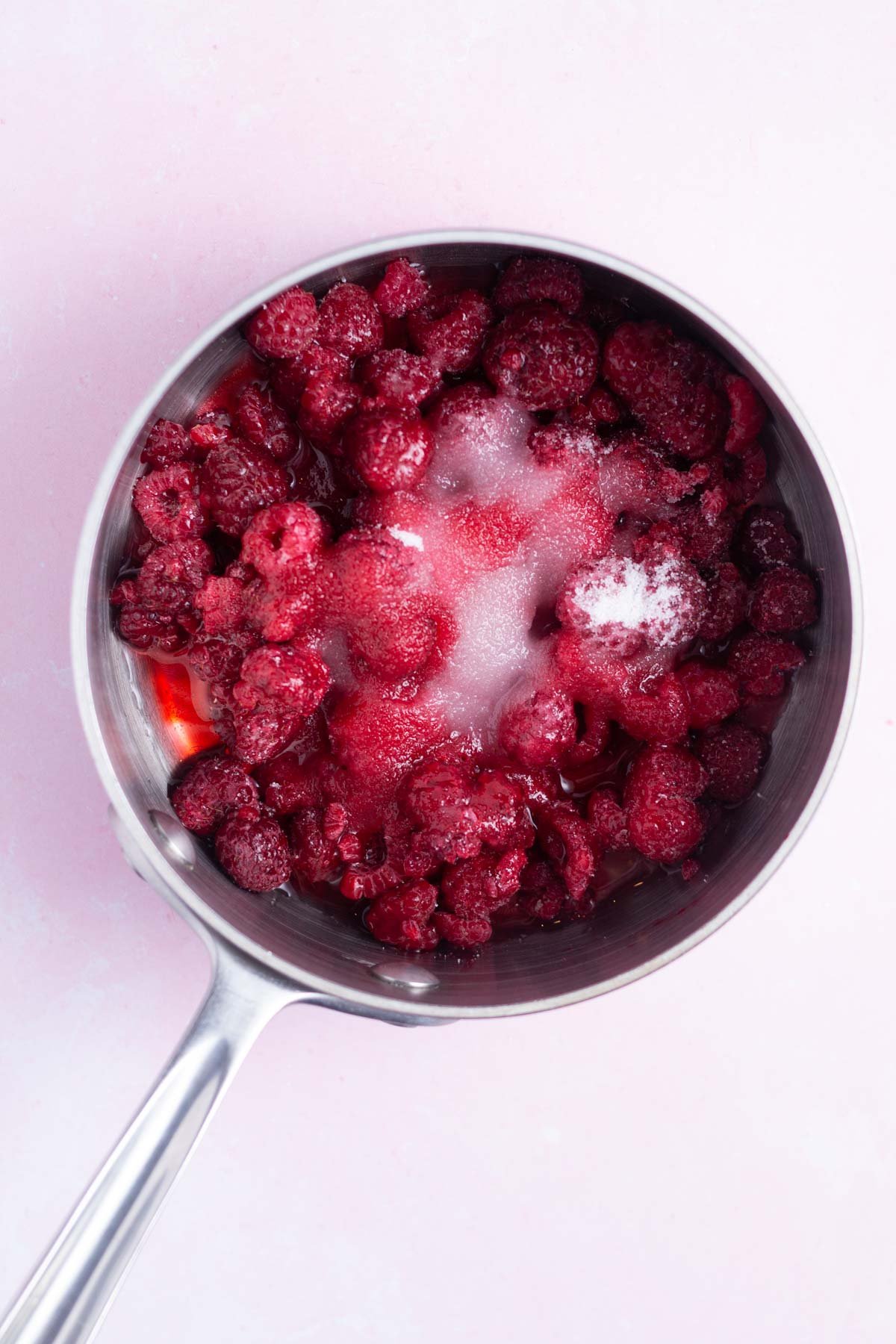 raspberries, sugar and water in a saucepan