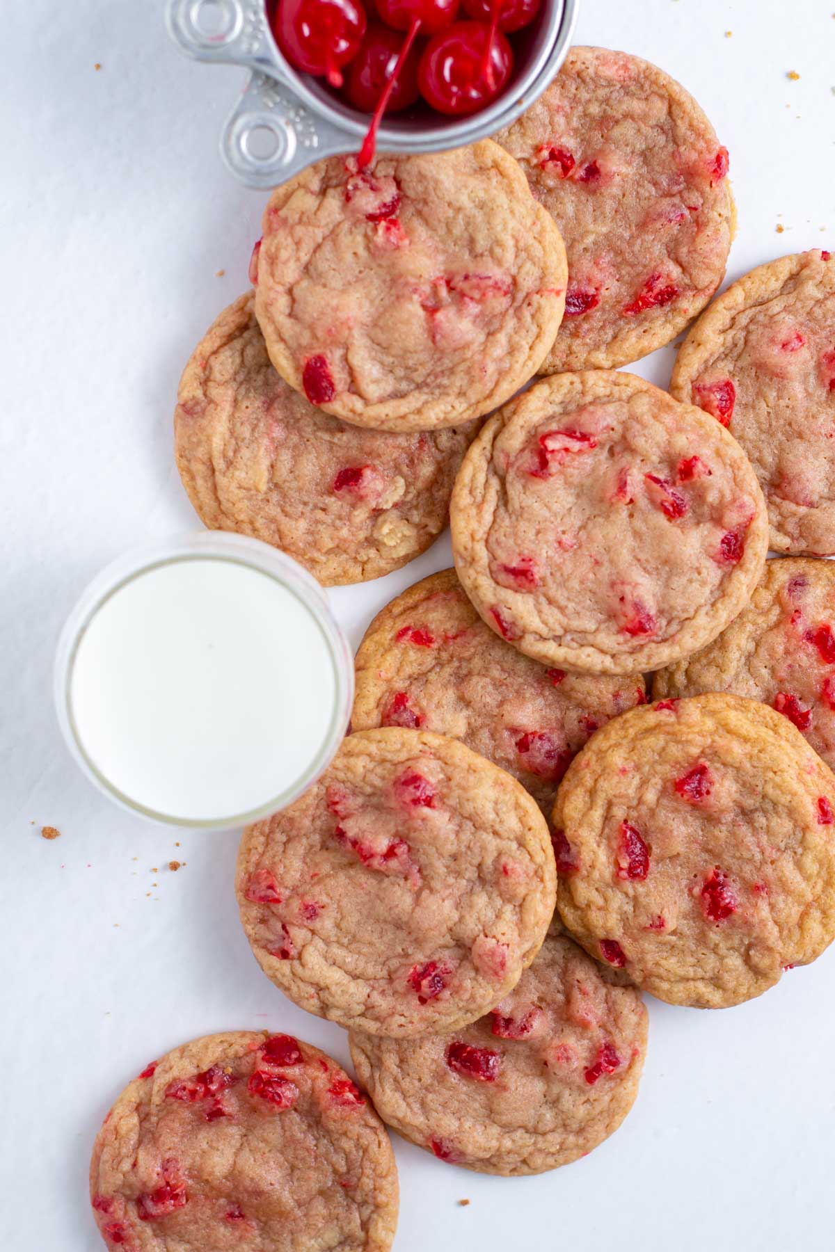 pile of cookies with a glass of milk