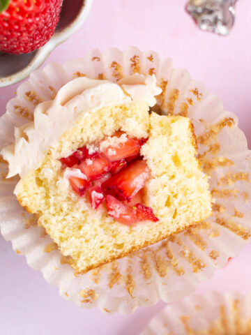 Inside look at a strawberry filled cupcakes.