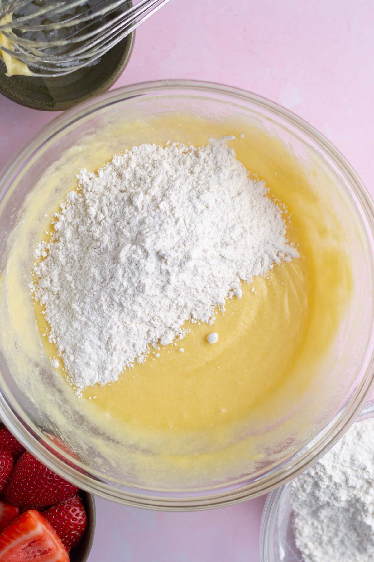 Flour being added to vanilla cake batter