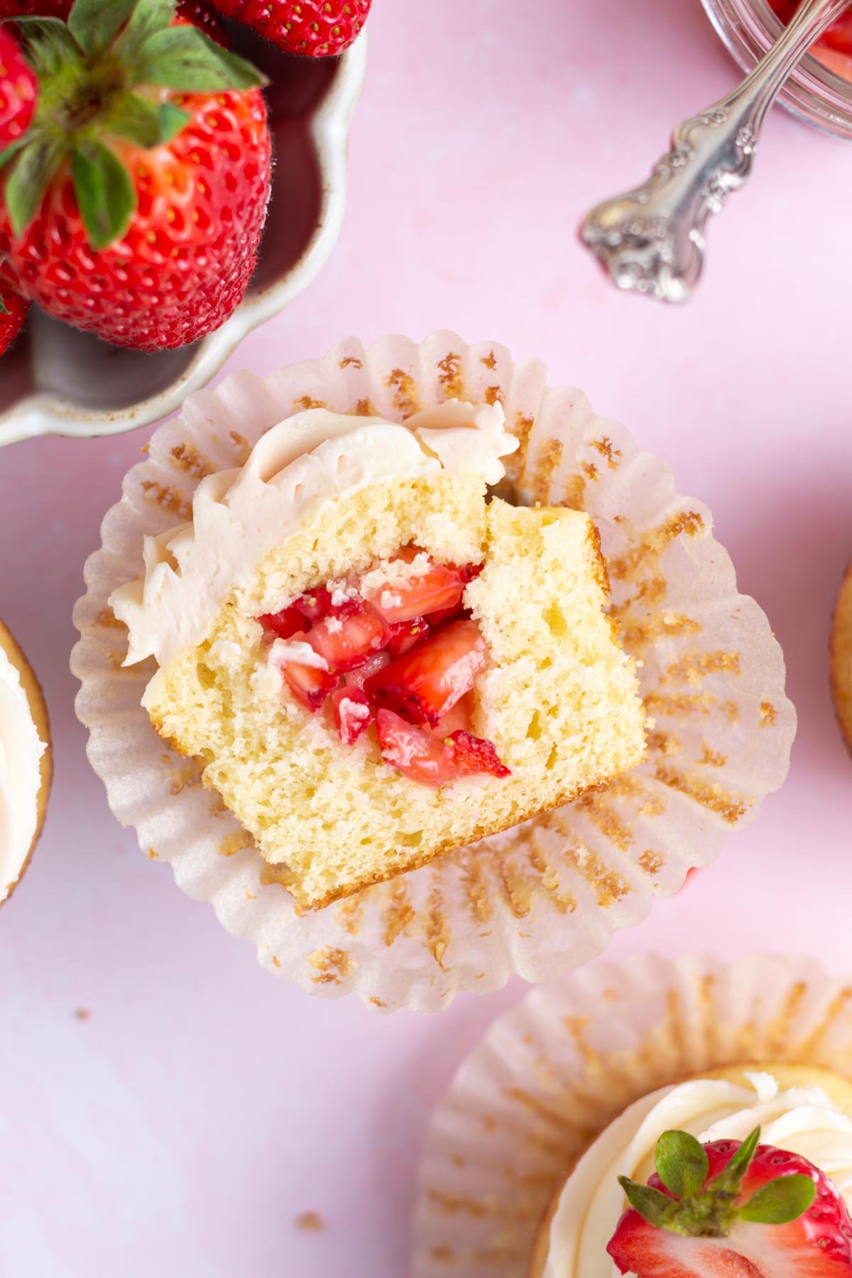 The inside of a strawberry filled cupcake.