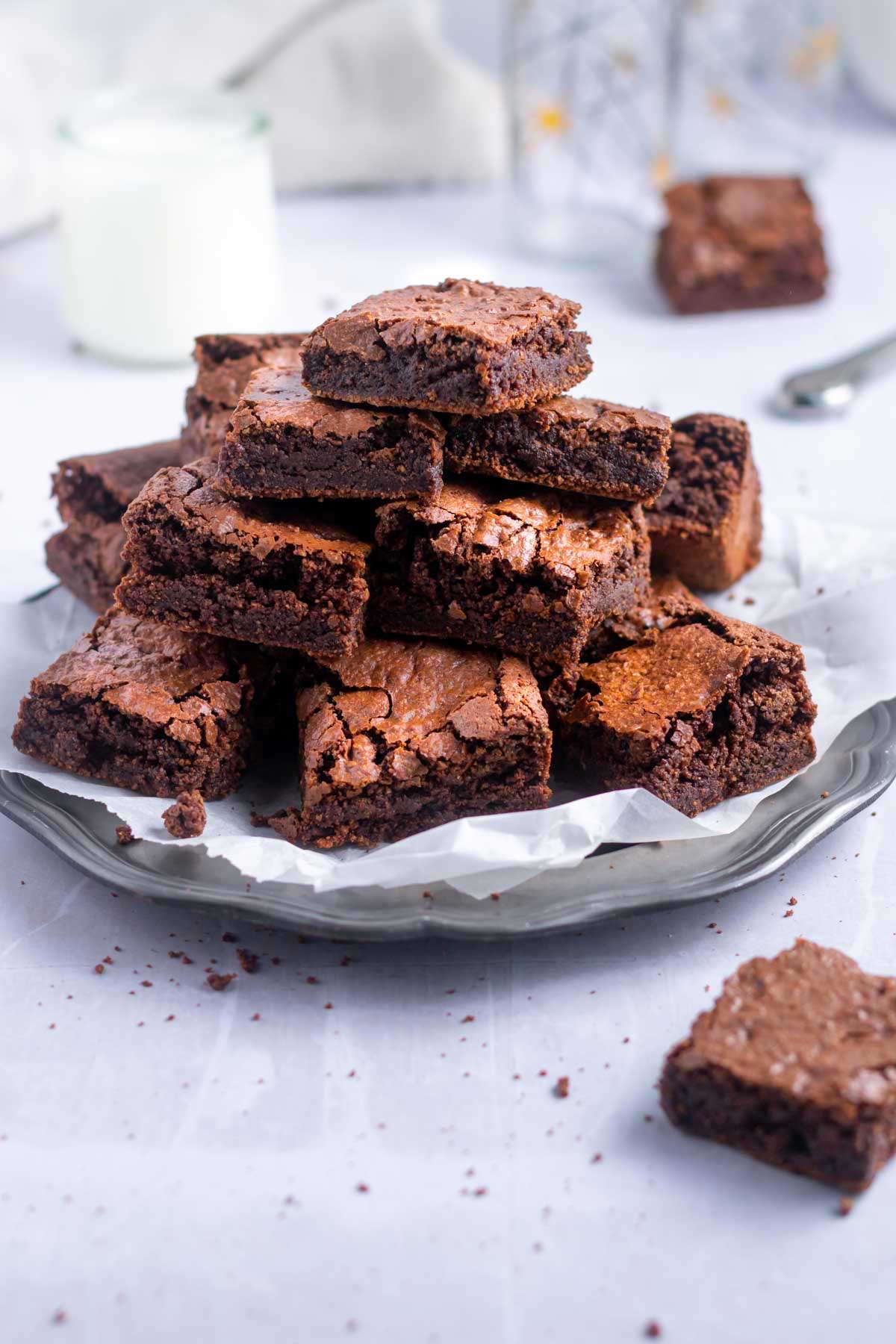 stack of almond brownies on a platter