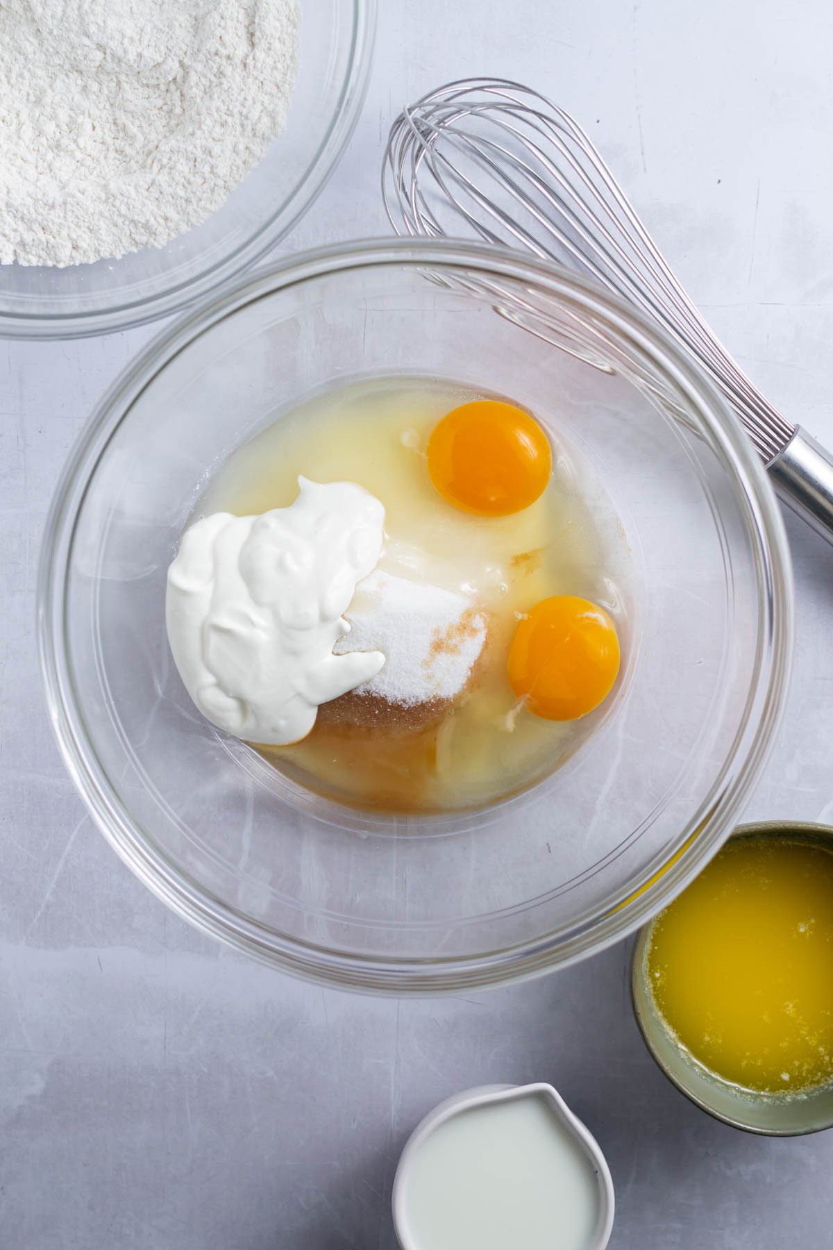 eggs, sugar, sour cream and vanilla in a mixing bowl