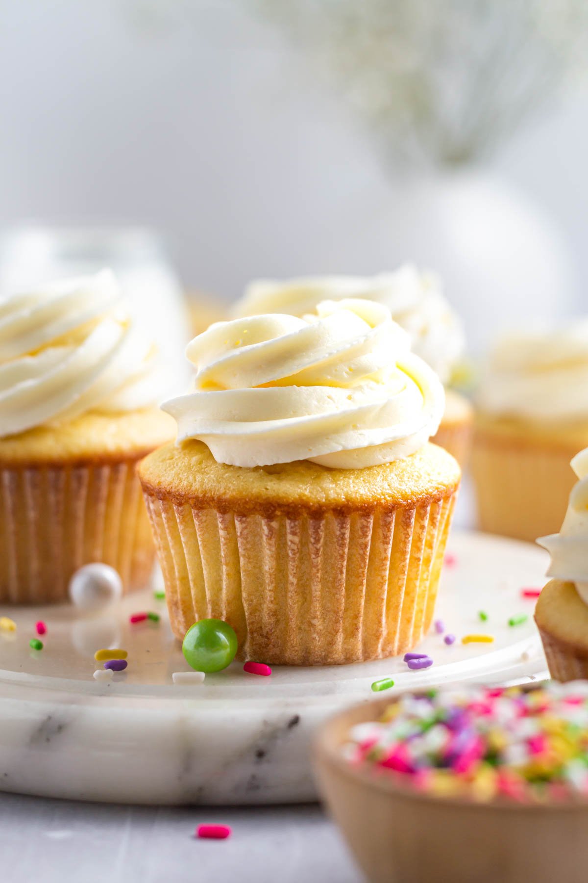 Easy vanilla cupcakes with vanilla buttercream and sprinkles