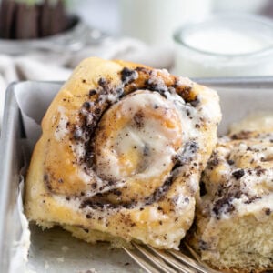 oreo cinnamon rolls with forks in a baking pan