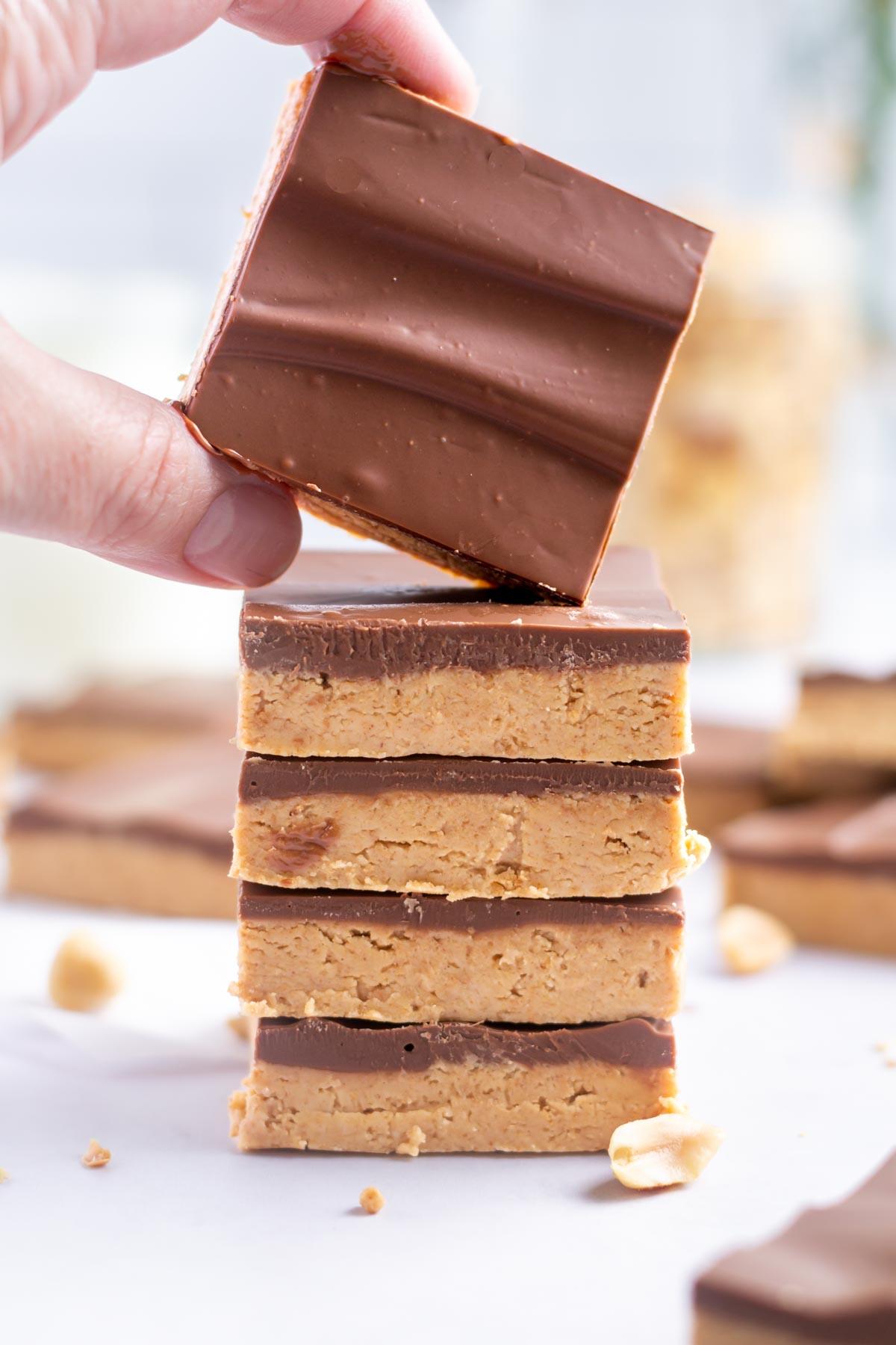 hand grabbing a buckeye bar off a stack