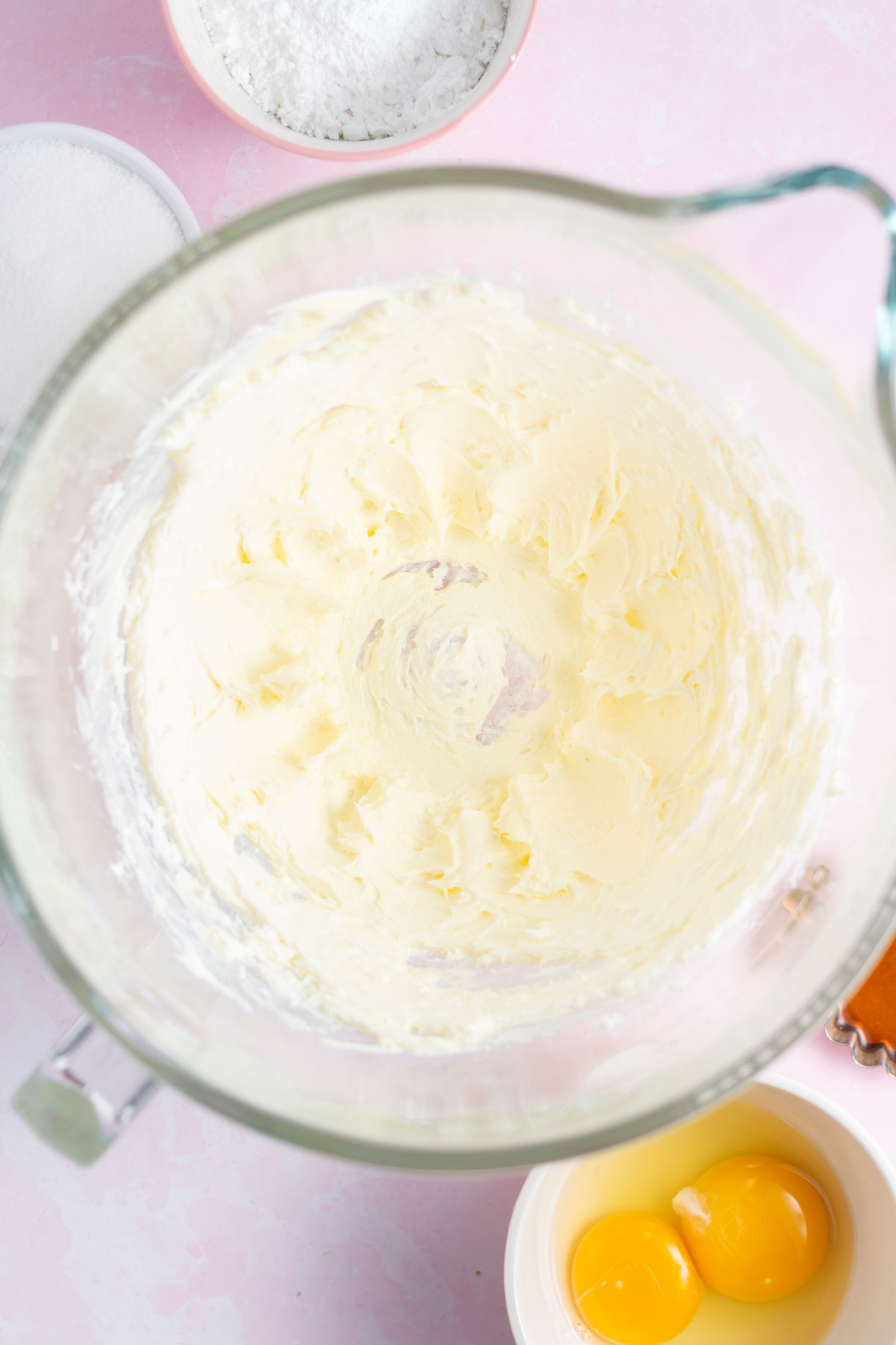 butter and cream cheese beat together in a mixing bowl