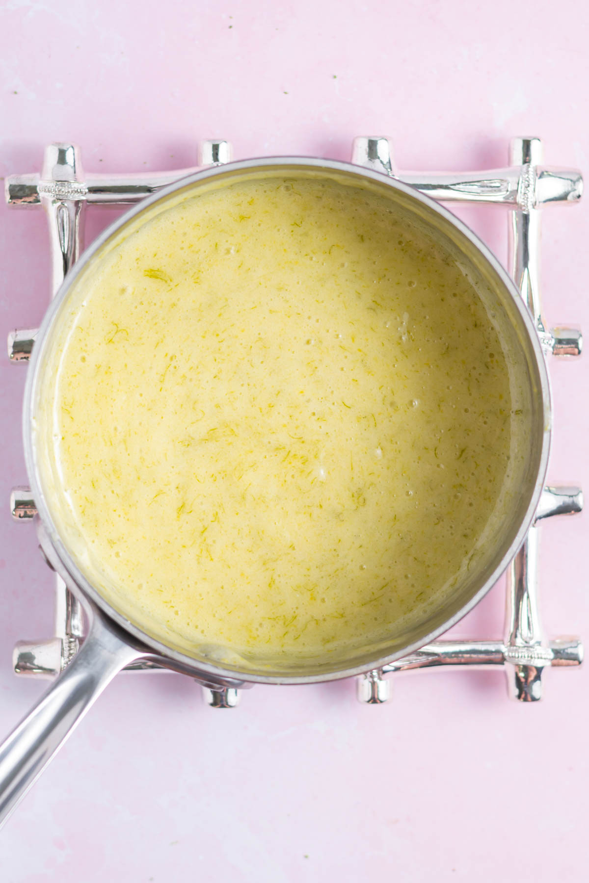 key lime curd after it's been cooked in a saucepan
