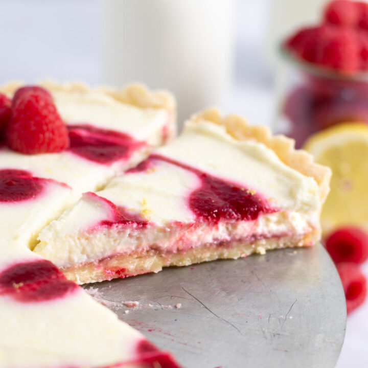 slice of lemon raspberry tart showing the layers